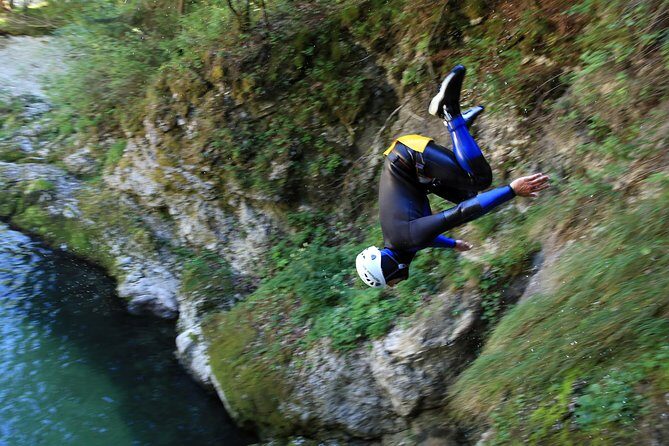 Bled and Bohinj Valley Canyoning with Hotel Pickup & Free Photos - Inside the canyon: forest walking, waterfalls, natural slides, and rope descent