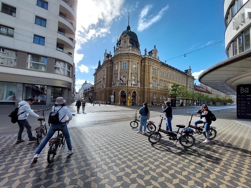 Ljubljana by E-Bike: Guided City Highlights Tour - Ljubljana Districts and the Riverfront Feel: More Than Just a Postcard Route