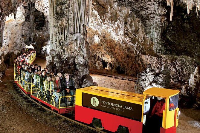 Postojna Cave and Predjama Castle Trip including entry tickets - Predjama Castle: Gothic fortress under a natural arch
